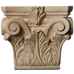 Intricately carved wooden capital showcasing classic architectural design, complementing a rustic brick backdrop. Perfect blend of elegance and craftsmanship in interior spaces.