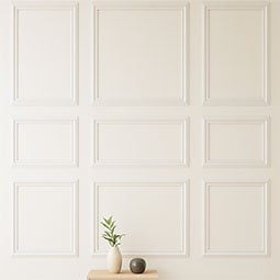 Elegant living room featuring decorative panel mouldings, showcasing a light color palette and stylish furniture, creating a bright and inviting atmosphere for modern interiors.