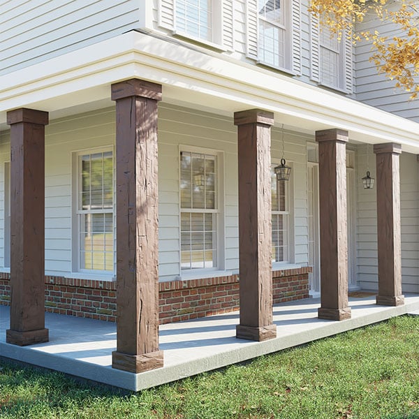Stylish faux wood columns enhance a charming porch, creating a welcoming outdoor space with a blend of traditional design and modern materials. Ideal for enhancing curb appeal.