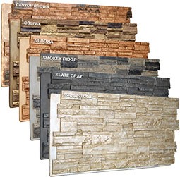 Display of various faux stone panels showcasing distinct colors and textures, including Canyon Brown, Colfax, Sedona, Smokey Ridge, Slate Gray, ideal for enhancing architectural designs.